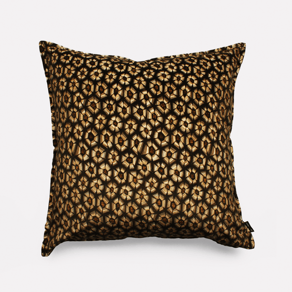 Front view of the Thanda Tortoise Silver Cushion Cover featuring a striking tortoise shell-inspired pattern in golden hues on a black velvet background.