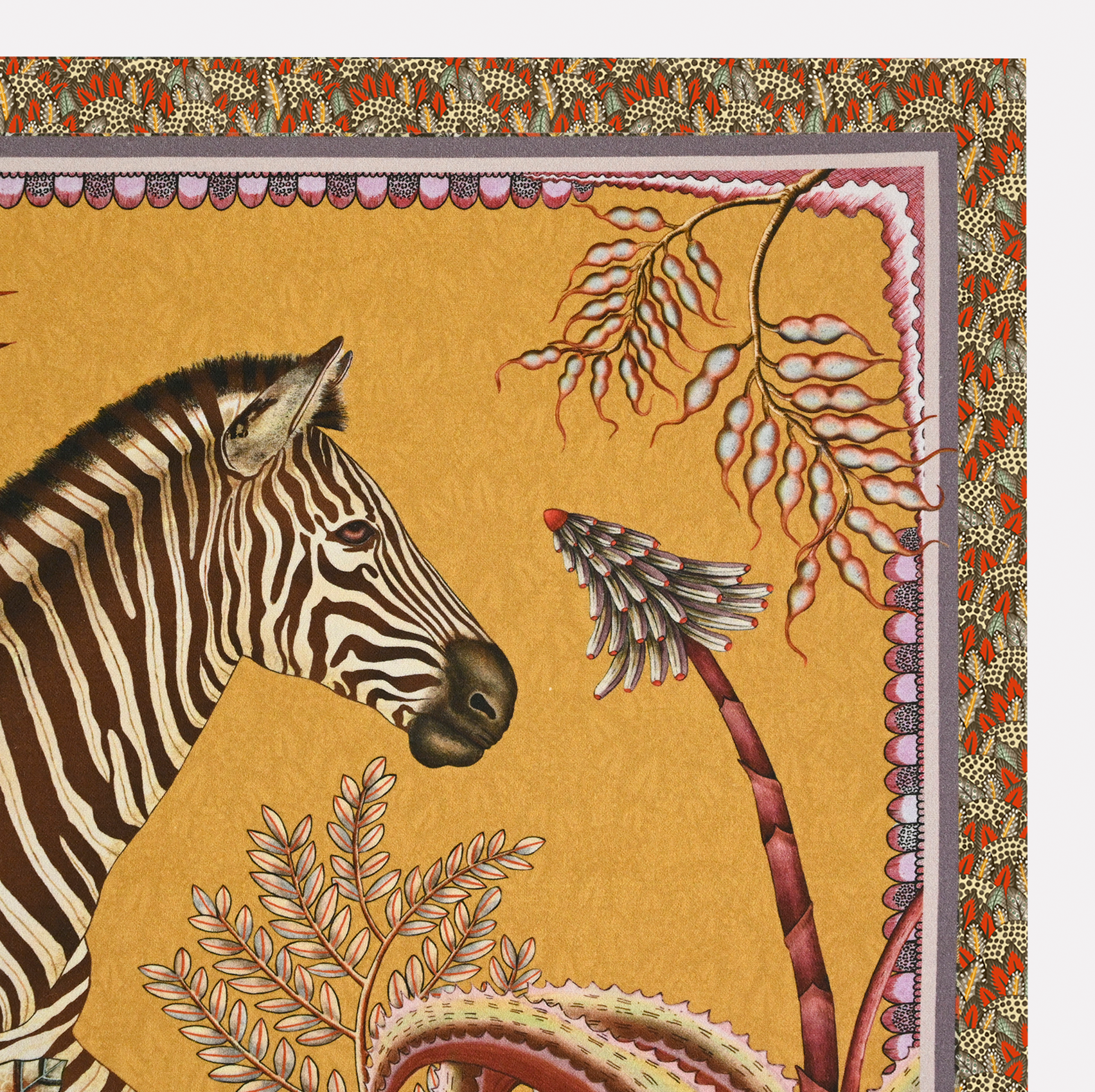 A close-up of the Ardmore Thanda Stripe Napkin in Magnolia, highlighting the zebra illustration with detailed foliage and floral motifs in warm golden hues.