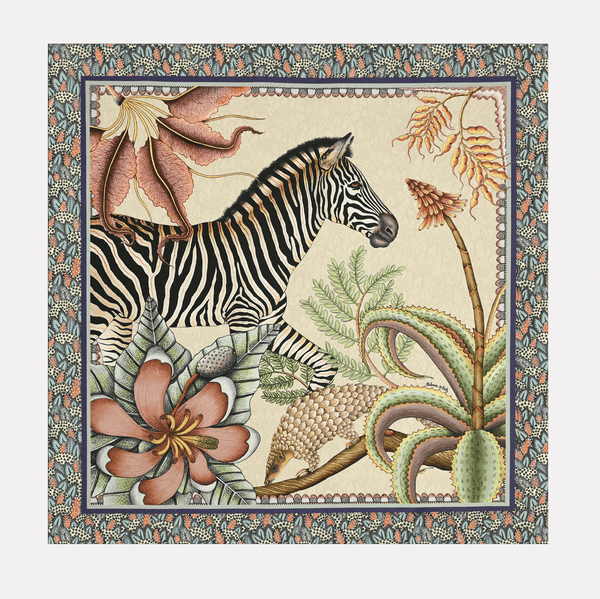 A full view of the Ardmore Thanda Stripe Napkin in Stone, featuring a zebra and pangolin surrounded by lush botanical elements in a detailed border.