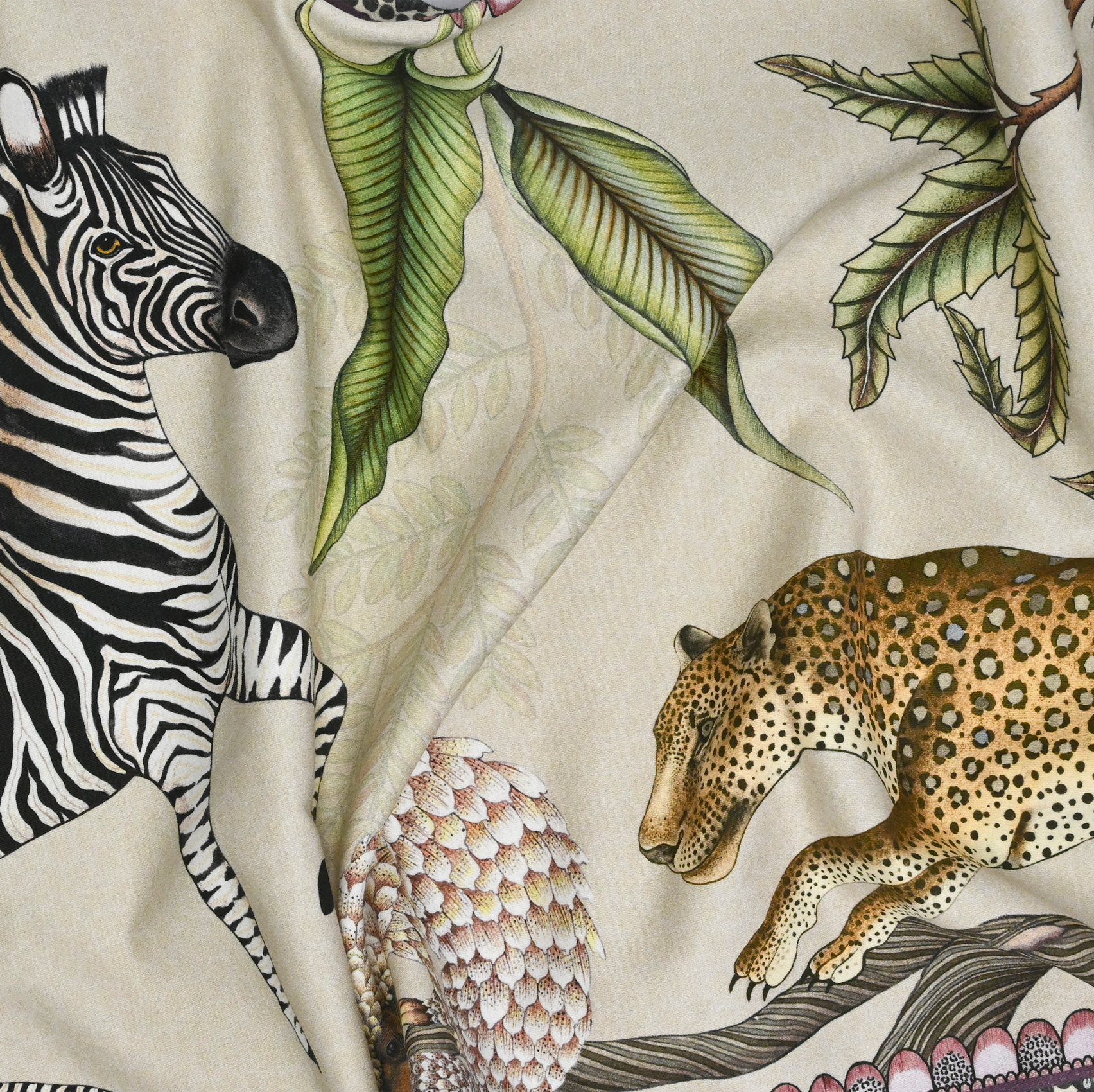 Another close-up highlighting a combination of flora and fauna, including exotic plants and hidden animals in the design.