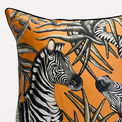 Side view of the Thanda Stripe Flame Silk Cushion Cover highlighting the detailed double-sided print with bold zebras and foliage patterns.