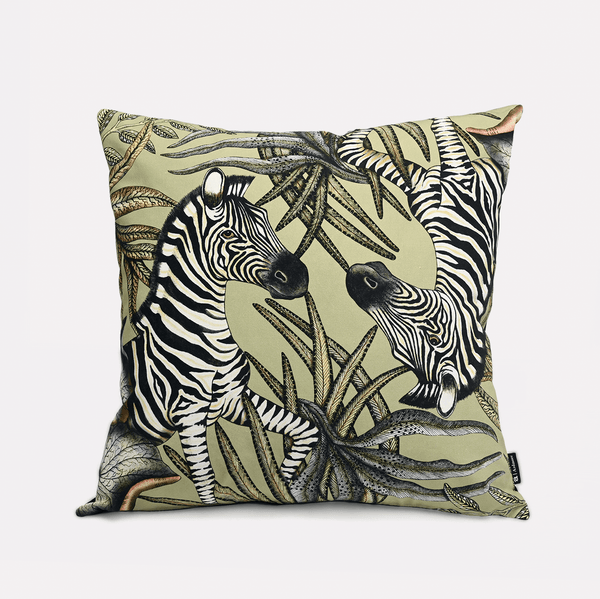 Front view of the Thanda Stripe Delta Cotton Cushion Cover, showcasing an elegant zebra design amidst lush African-inspired foliage on a soft beige background.