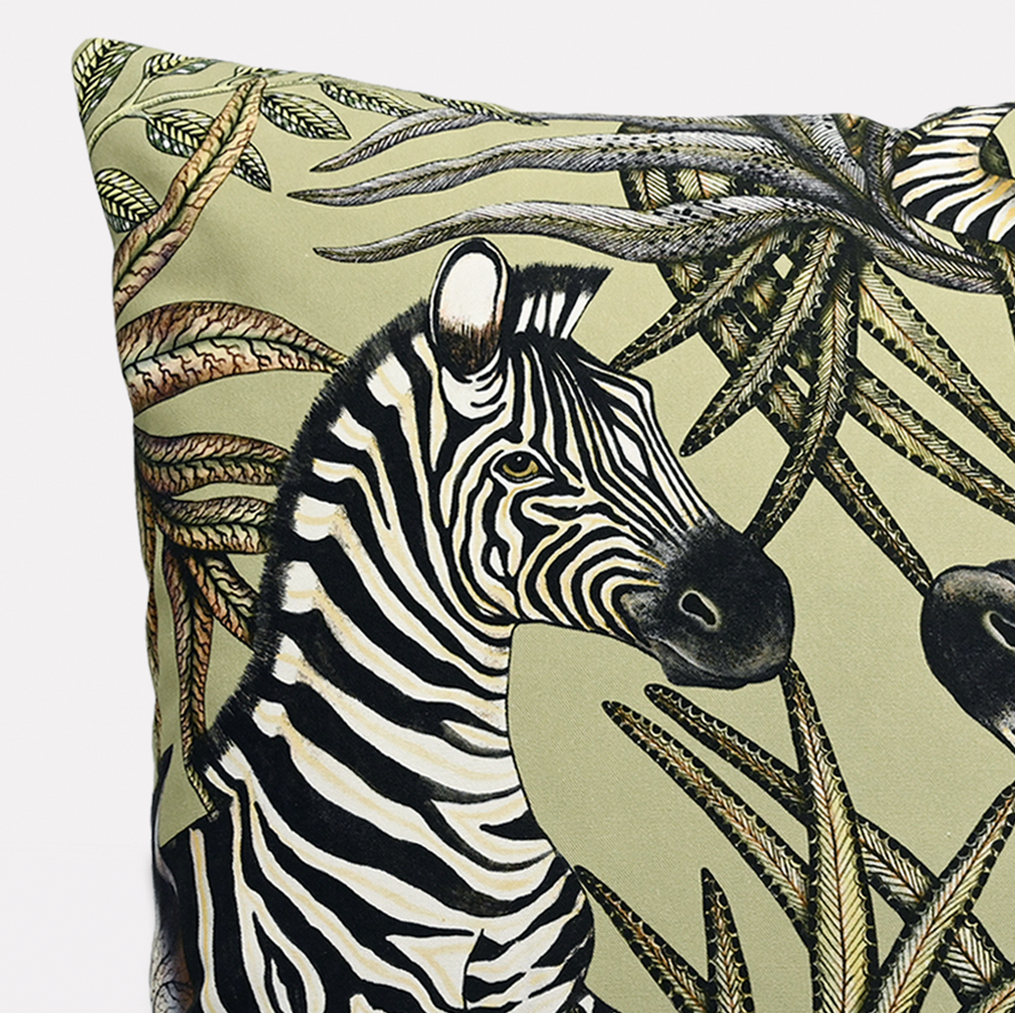 Side view of the Thanda Stripe Delta Cotton Cushion Cover, emphasising the intricate zebra patterns and vibrant greenery.