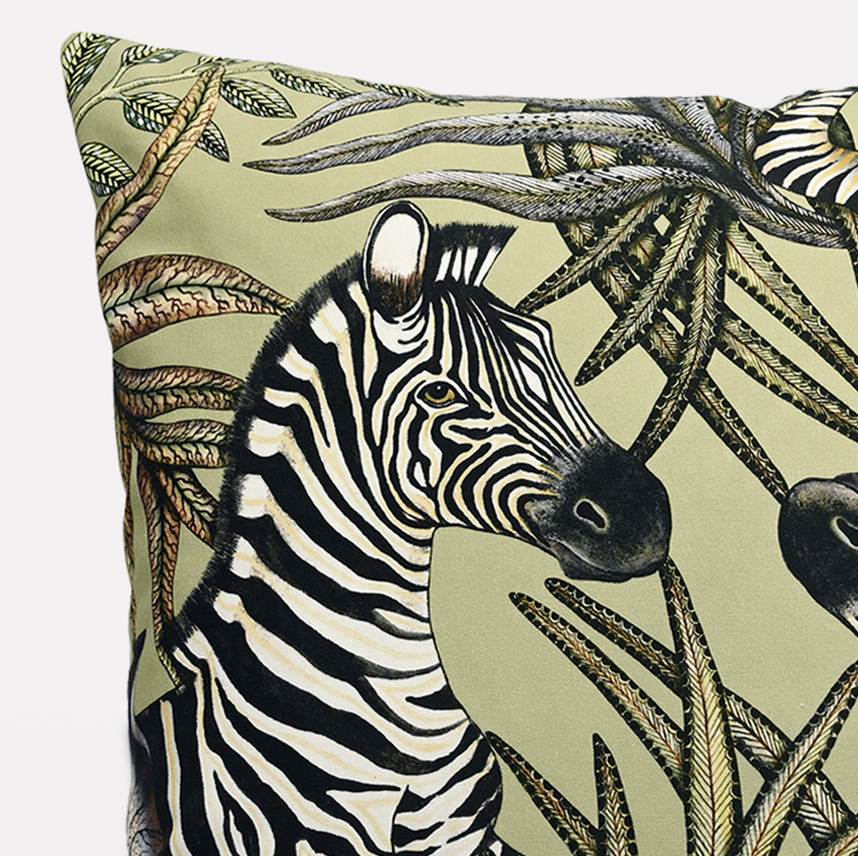 Side view of the Thanda Stripe Delta Cotton Cushion Cover, emphasising the intricate zebra patterns and vibrant greenery.