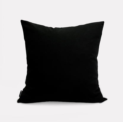 Reverse side of the Thanda Stripe Delta Cotton Cushion Cover in a classic black cotton fabric, highlighting its versatile and sleek design.