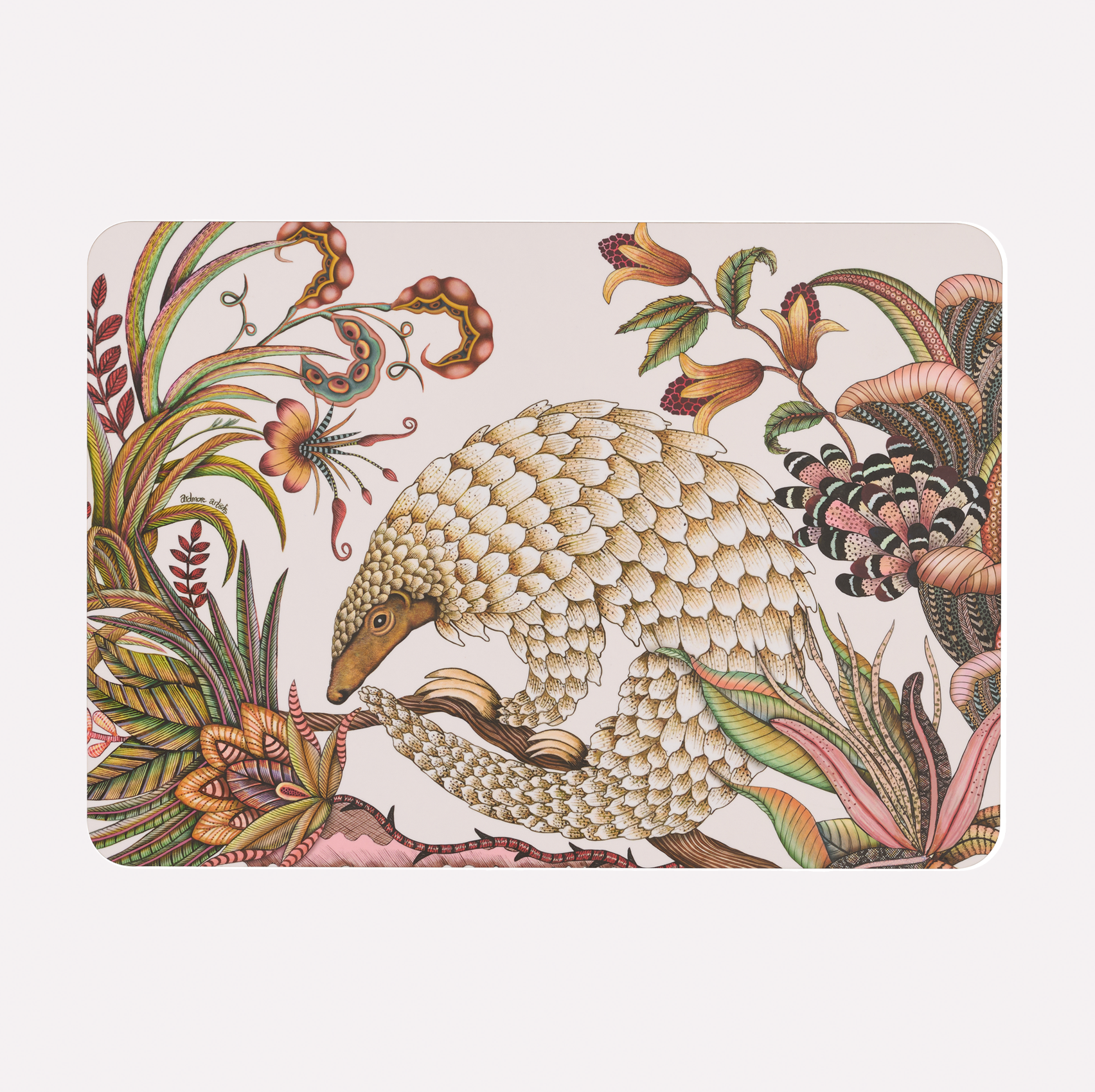 A hardboard placemat featuring an intricate illustration of a golden pangolin amidst detailed floral and botanical patterns on a white background.