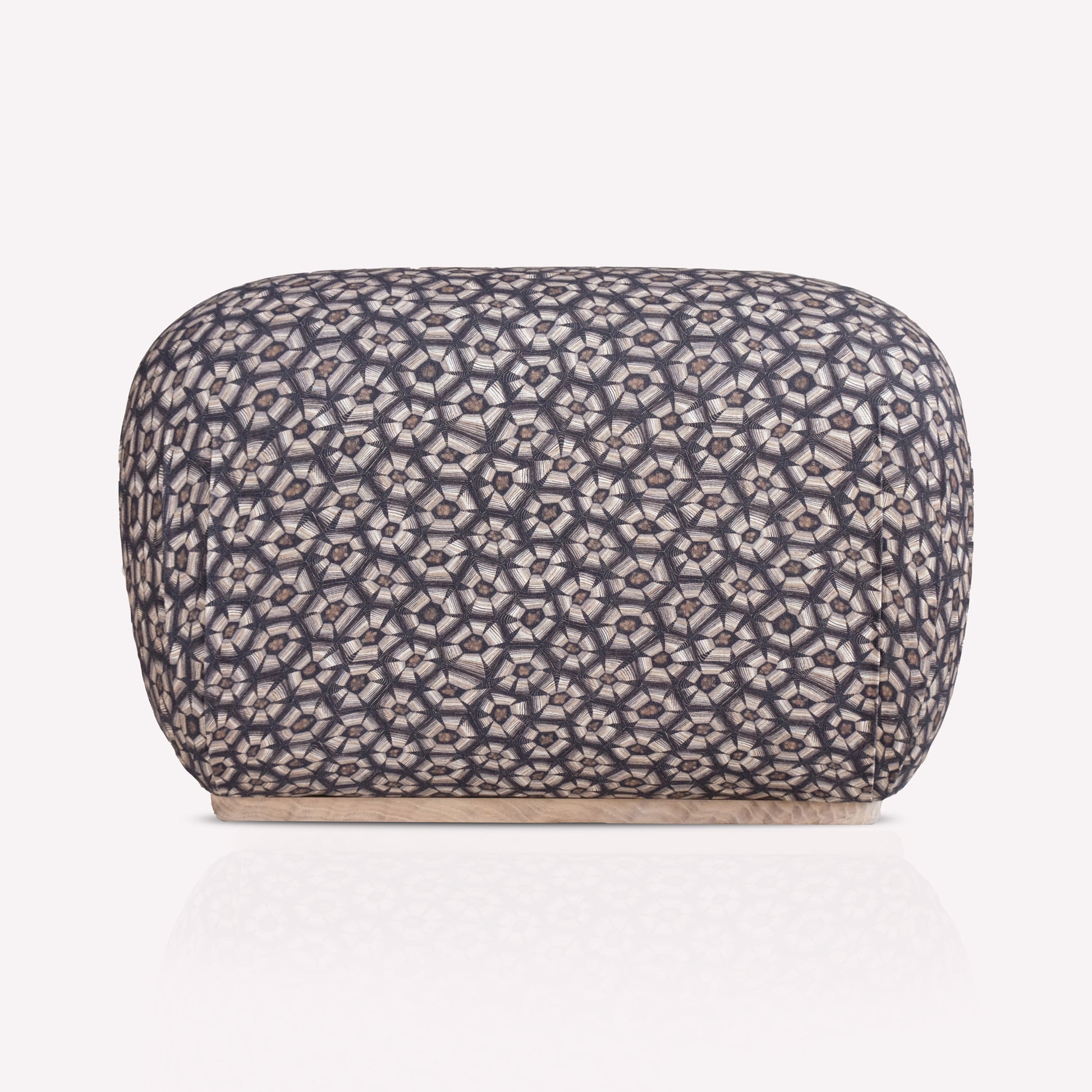 A luxurious Nyala Ottoman with a refined tortoise-shell pattern in silver and charcoal hues. The ottoman has a smooth, rounded rectangular shape, providing a plush and sophisticated seating or decorative element.