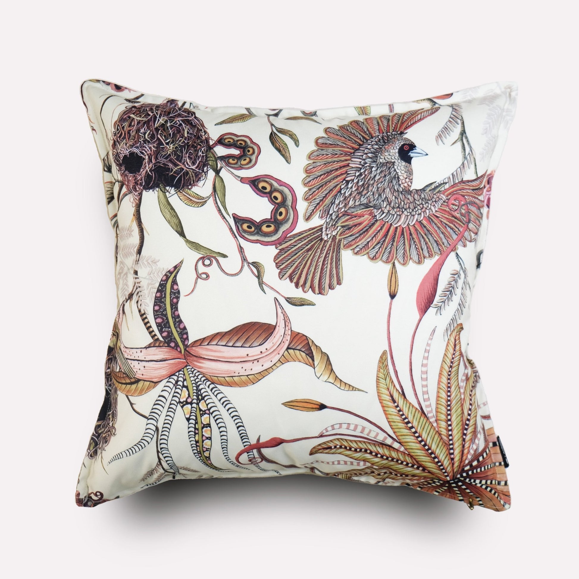 Angled view of the Thanda Nests Plum Outdoor Cushion Cover, highlighting its intricate botanical and bird-inspired patterns.