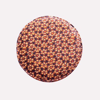 Showcasing the symmetry of the tortoise shell-inspired pattern and the luxurious texture of the velvet fabric.