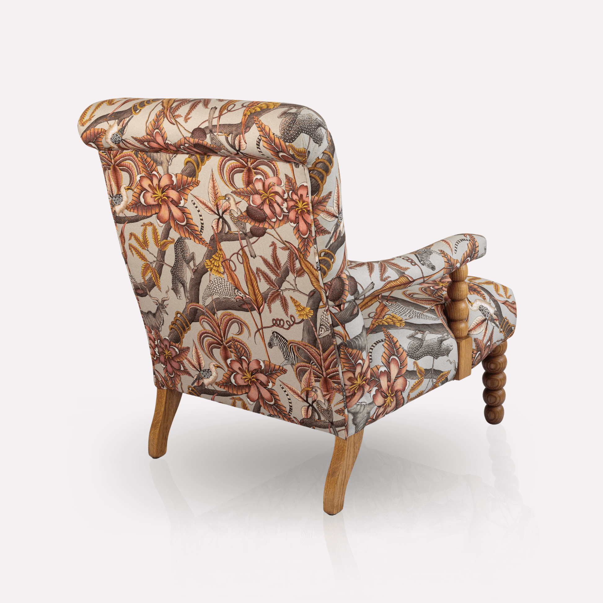 Rear view of the Ardmore Kudu Pod Chair in Pangolin Plum Velvet, highlighting the striking pattern, high backrest, and seamless upholstery craftsmanship
