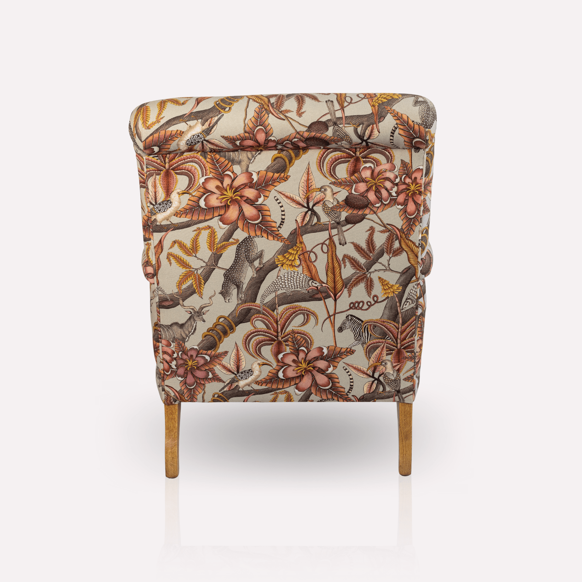 Angled perspective of the Ardmore Kudu Pod Chair in Pangolin Plum Velvet, capturing its elegant silhouette, plush comfort, and timeless African-inspired design.
