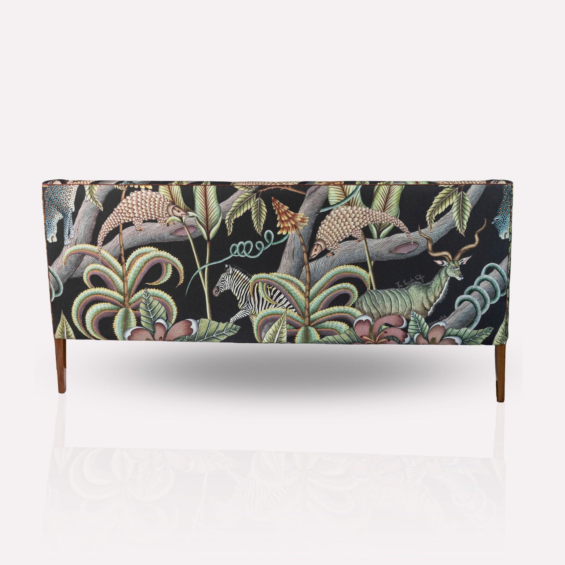 Close-up of the Ardmore Thanda Sofa Limited Edition’s fabric, capturing the vibrant hand-painted Pangolin Park motifs.