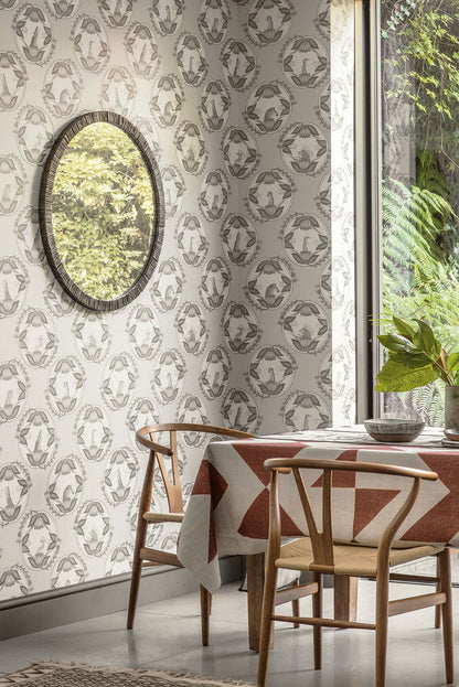 A beautifully styled interior setting featuring the soft olive green Cameos Wallpaper, illustrating its versatility and harmonious integration into refined décor.