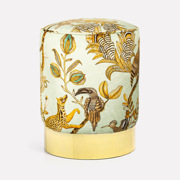 Front view of the Ardmore Camp Critter Mist Velvet Pouffe, featuring intricate African-inspired designs on plush velvet fabric with a polished brass base.