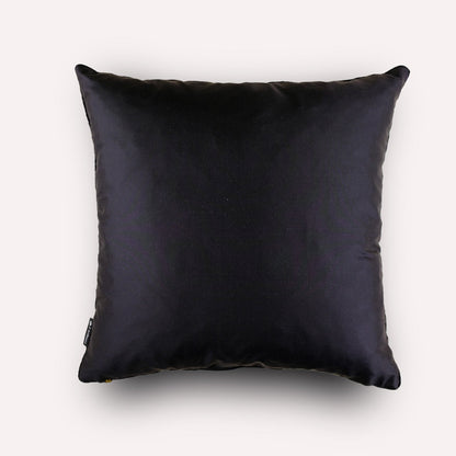 Back view of the Thanda Pangolin in Night Silk Cushion Cover, featuring plain black silk with refined piping detail.