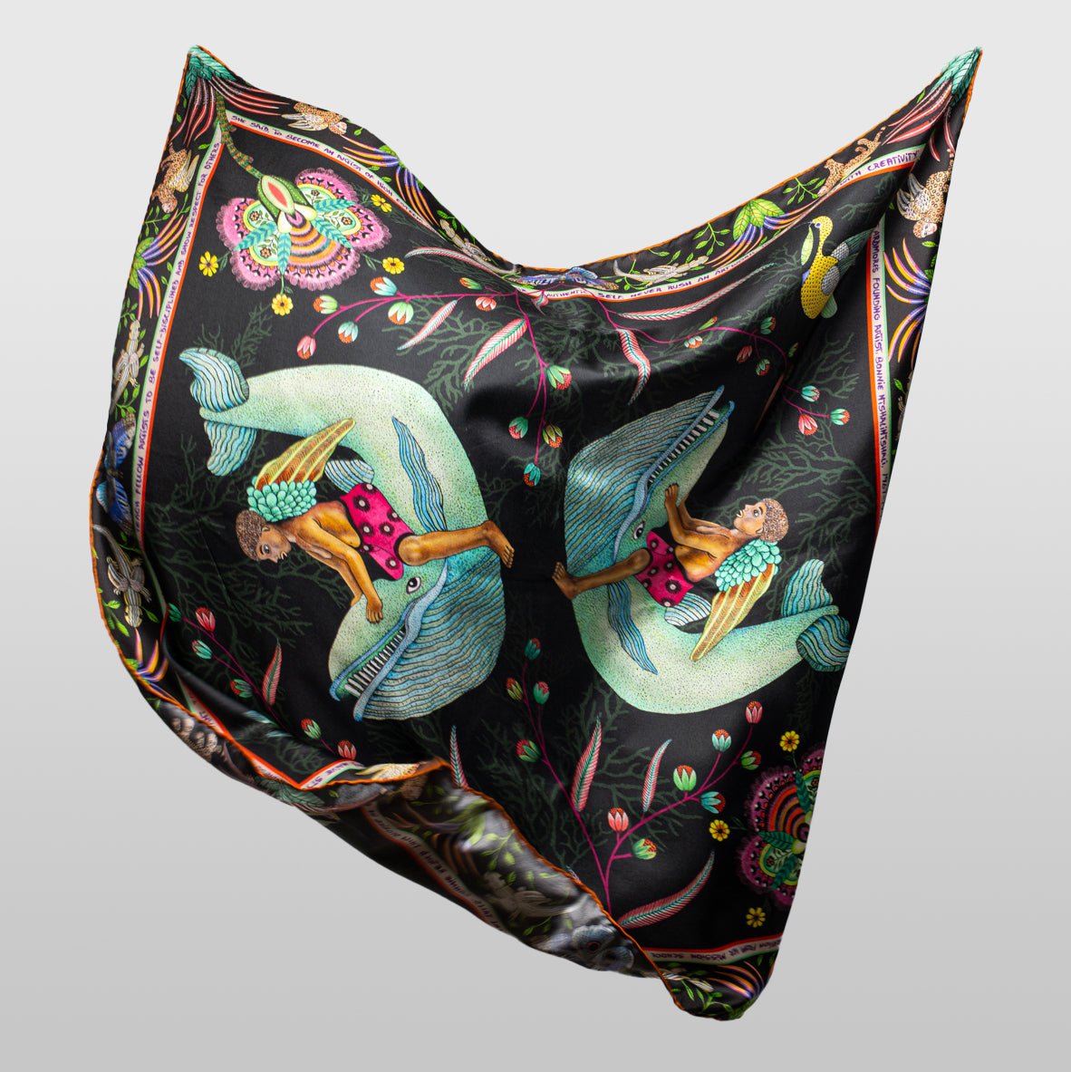 The scarf shown in a natural draped position, emphasising its smooth silk texture and lightweight flow.