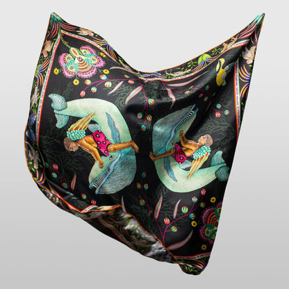 The scarf shown in a natural draped position, emphasising its smooth silk texture and lightweight flow.