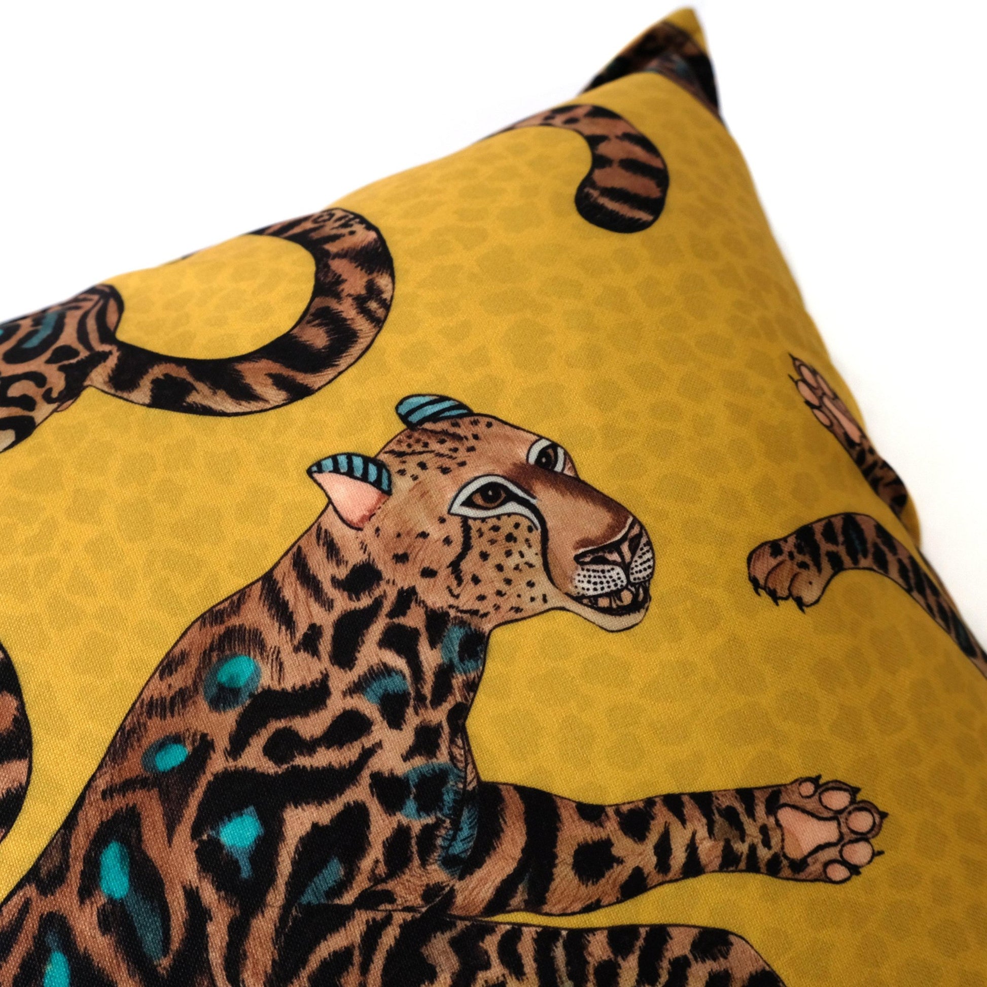 Close-up of the Cheetah King Gold cushion cover, highlighting the intricate details of a cheetah figure and its textured black and gold pattern.