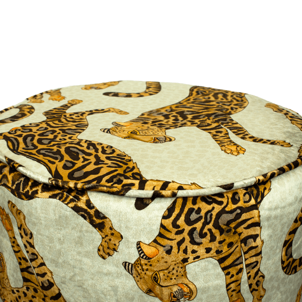 Close-up of the Ardmore Cheetah Kings Stone Velvet Pouffe, highlighting the detailed cheetah artwork and luxurious texture of the velvet fabric, exuding African-inspired sophistication.