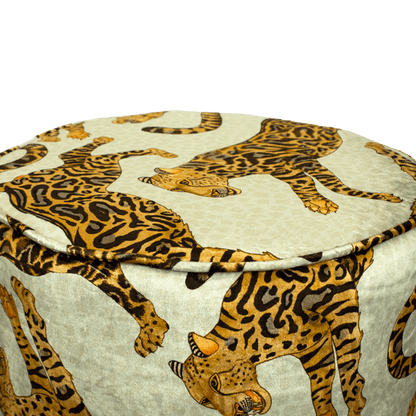 Close-up of the Ardmore Cheetah Kings Stone Velvet Pouffe, highlighting the detailed cheetah artwork and luxurious texture of the velvet fabric, exuding African-inspired sophistication.