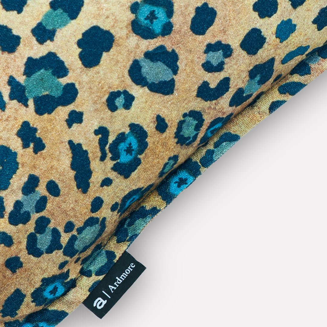 Corner detail of the Thanda Safari Spot Midnight Cushion Cover, displaying the elegant finish and fine stitching.