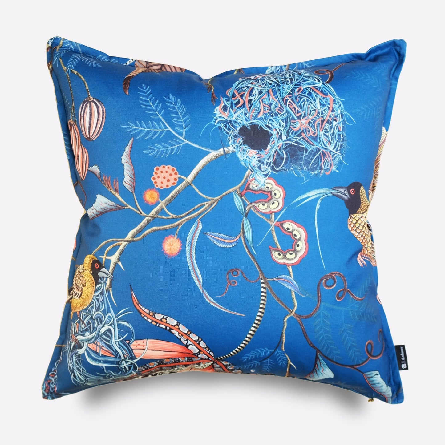 Front view of the Thanda Nests Midnight Outdoor Cushion Cover, featuring a striking blue background with intricate bird nest-inspired botanical designs in orange and gold.