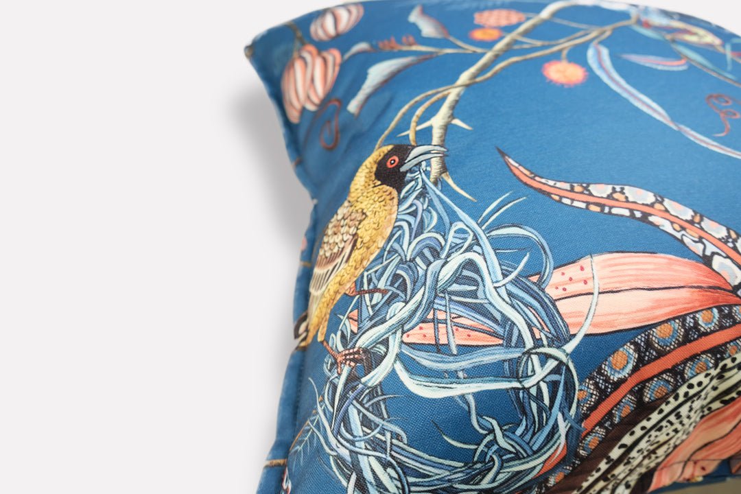 Close-up side view of the Thanda Nests Midnight Outdoor Cushion Cover, highlighting the detailed patterns and stitching.