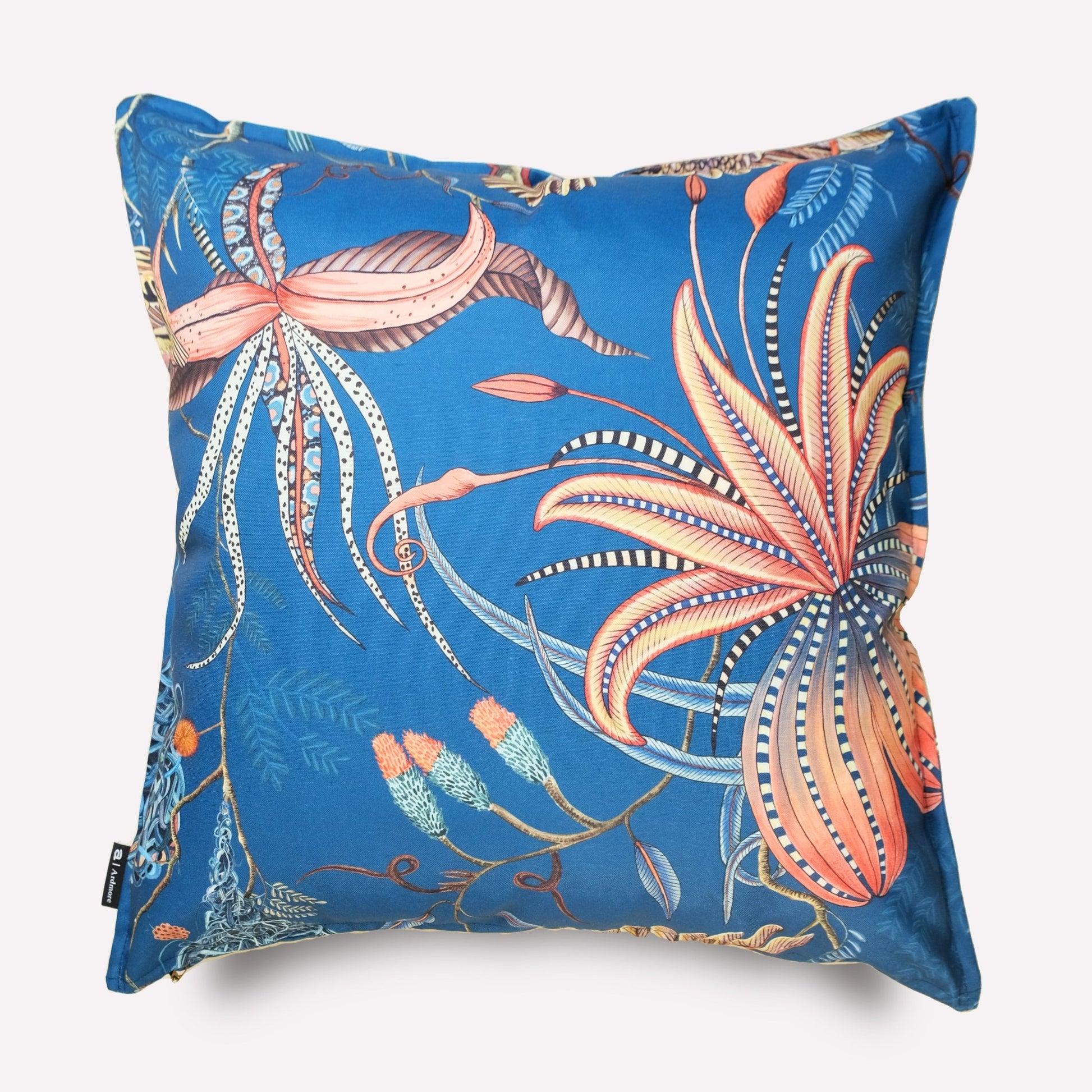 Angled view of the Thanda Nests Midnight Outdoor Cushion Cover, showcasing its vibrant floral and fauna-inspired artwork.