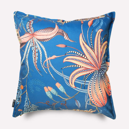 Angled view of the Thanda Nests Midnight Outdoor Cushion Cover, showcasing its vibrant floral and fauna-inspired artwork.