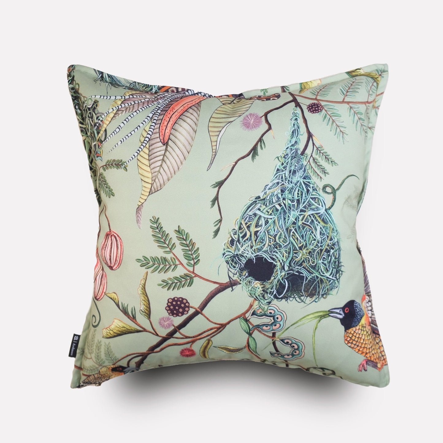 Angled view of the Thanda Nests Delta Outdoor Cushion Cover, showcasing its elegant nature-themed pattern and fabric texture.