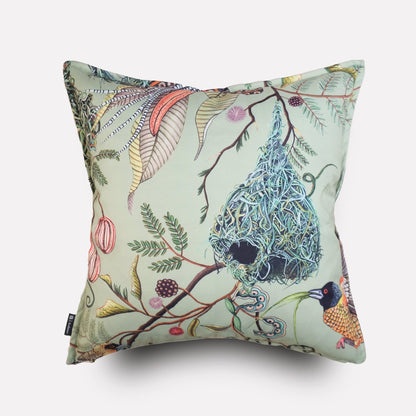Angled view of the Thanda Nests Delta Outdoor Cushion Cover, showcasing its elegant nature-themed pattern and fabric texture.