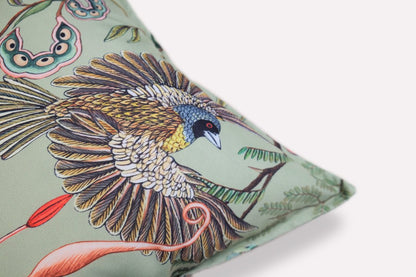 Close-up of the corner of the Thanda Nests Delta Outdoor Cushion Cover, showing the intricate pattern details, stitching, and the branded fabric tag.