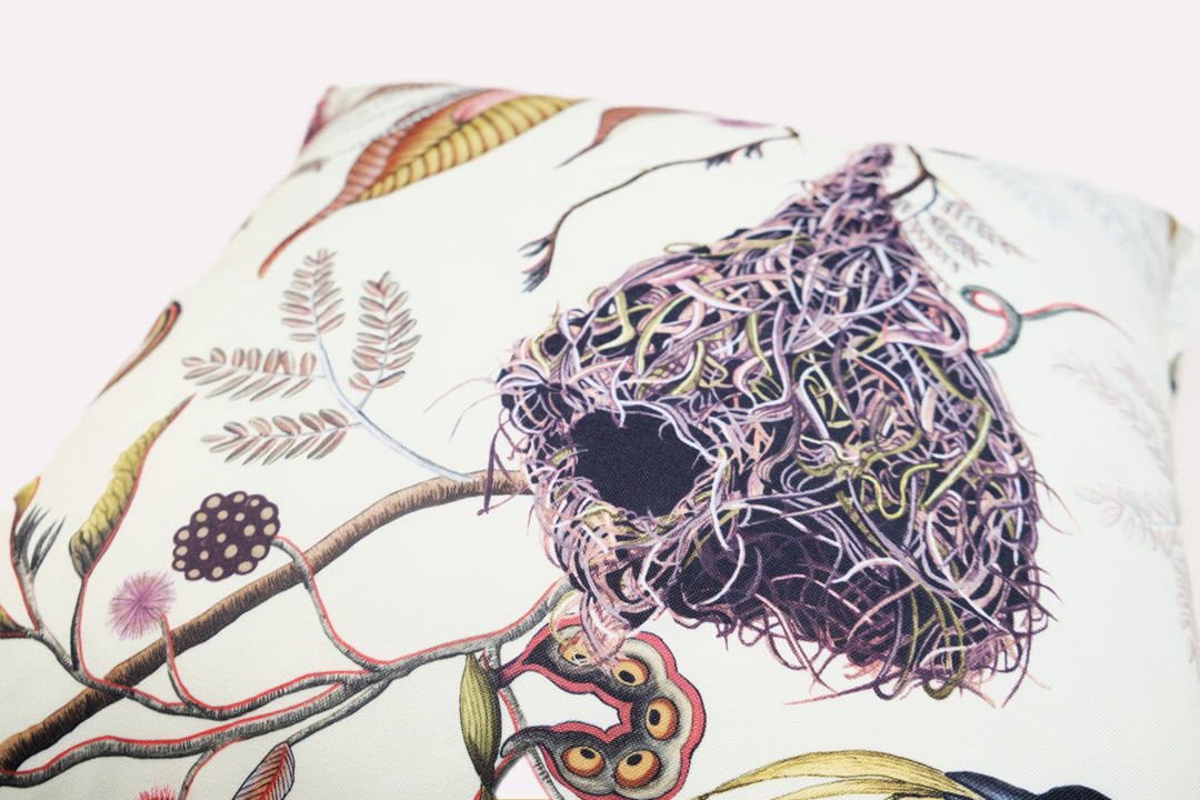 Close-up side view of the Thanda Nests Plum Outdoor Cushion Cover, emphasising the detailed stitching and vibrant plum accents.