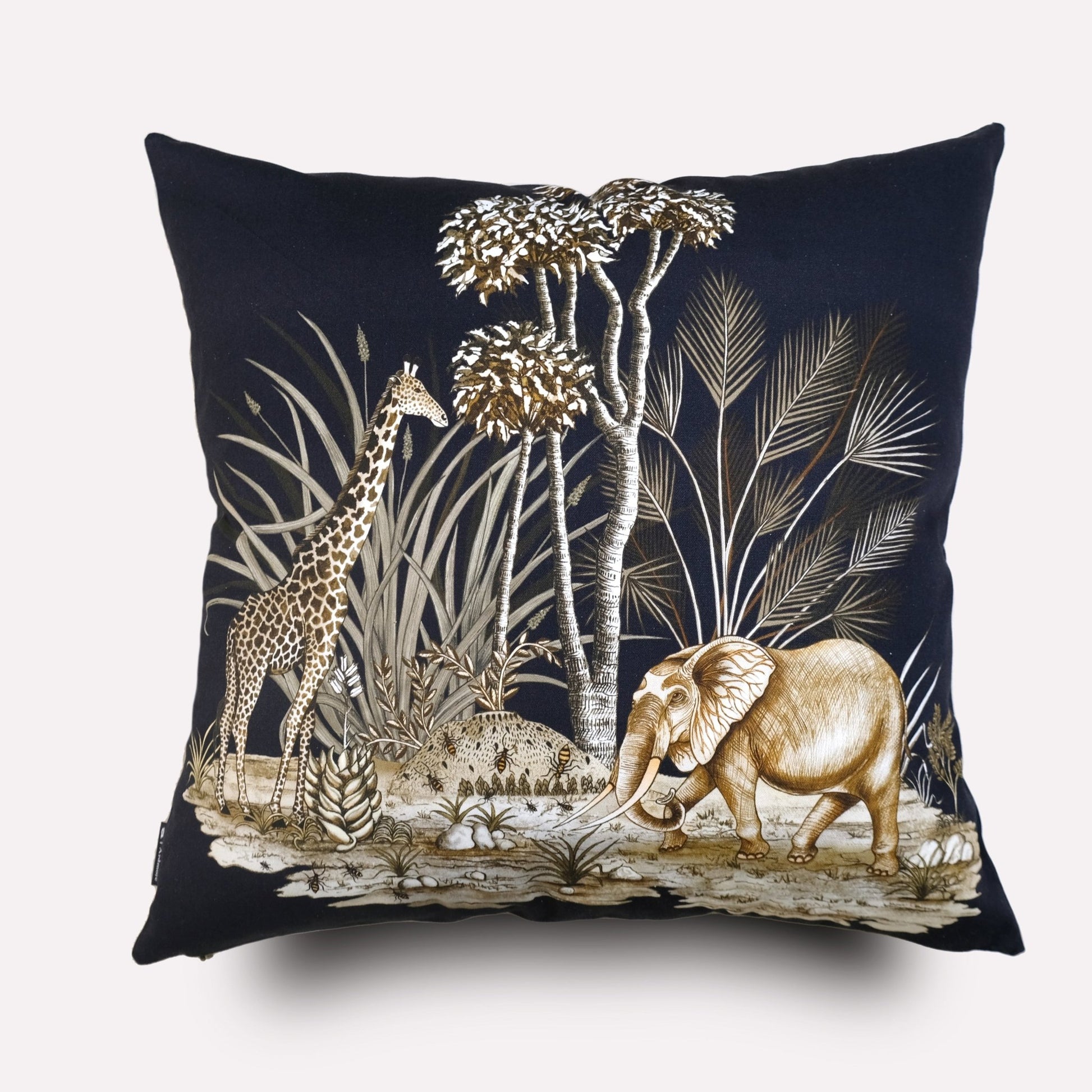 A closer view of the cushion, showcasing the detailed embroidery and artwork of the elephant amidst tall African plants, emphasising the high-quality craftsmanship.