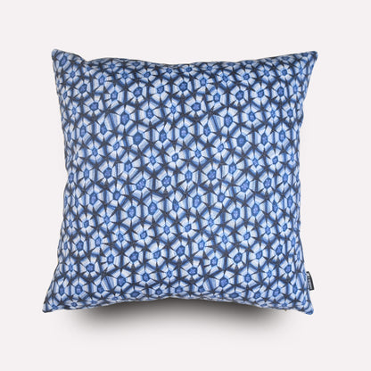 Front view of the Thanda Tortoise Tanzanite Cushion Cover, featuring an intricate blue and white geometric pattern inspired by the leopard tortoise’s shell.