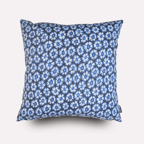 Front view of the Thanda Tortoise Tanzanite Cushion Cover, featuring an intricate blue and white geometric pattern inspired by the leopard tortoise’s shell.