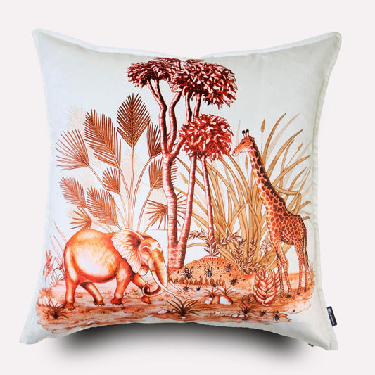 Front view of the Thanda Toile Plum Velvet Cushion Cover, featuring a white background with a detailed toile design in warm plum tones, depicting an African wildlife scene with an elephant resting under tall floral elements.