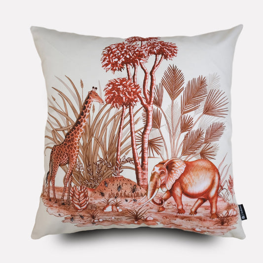 A square cushion cover with a white background, featuring an intricate plum-coloured wildlife illustration with elephants, giraffes, and African flora.