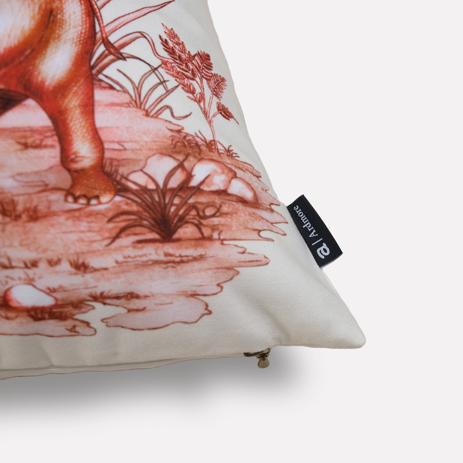 A side-angle shot of the cushion, showing its luxurious texture and the detailed foliage pattern in soft plum tones.