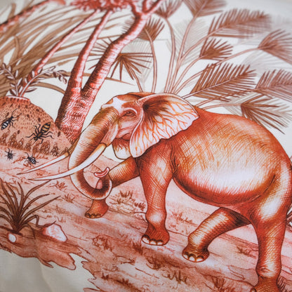 A close-up of an elephant among lush African plants, emphasising the elegant plum colour scheme and artistic design.