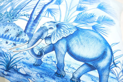 A zoomed-in section of the cushion featuring a giraffe surrounded by African trees, demonstrating the intricate toile pattern.