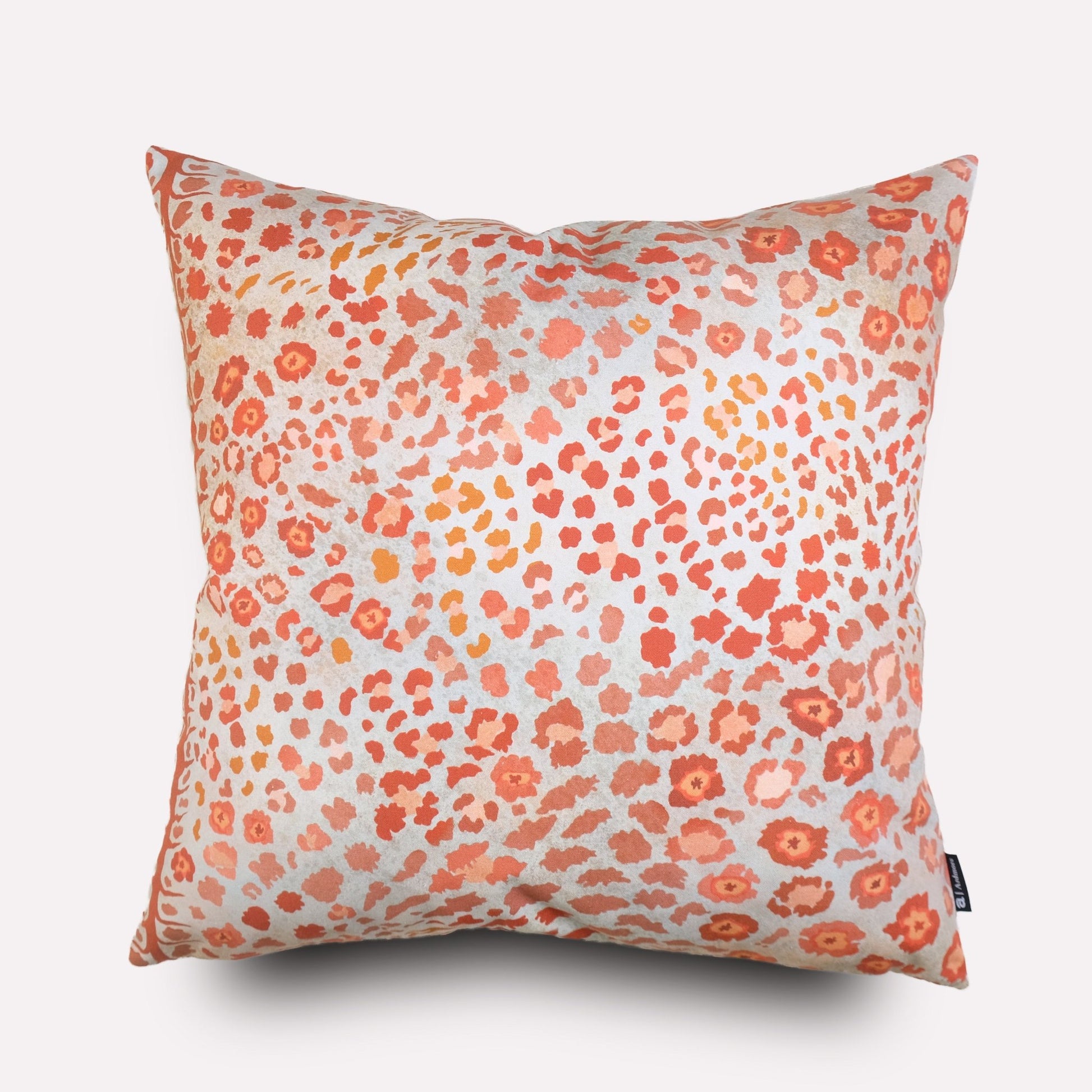 Front view of the Safari Spot Coral Cushion Cover, featuring a vibrant coral and pink leopard-print pattern on cotton fabric.