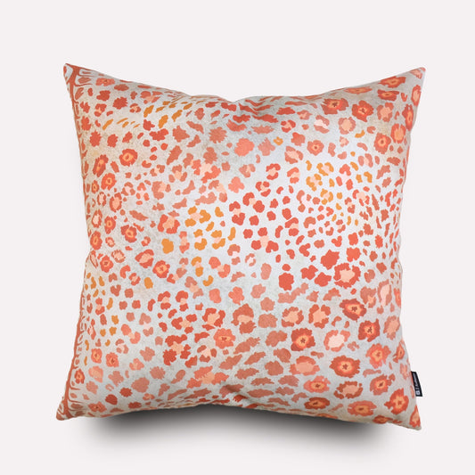 Front view of the Safari Spot Coral Cushion Cover, featuring a vibrant coral and pink leopard-print pattern on cotton fabric.