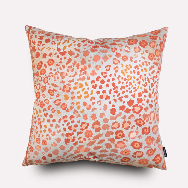 Front view of the Safari Spot Coral Cushion Cover, featuring a vibrant coral and pink leopard-print pattern on cotton fabric.