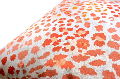 Angled view of the Safari Spot Coral Cushion Cover, showcasing its bold leopard-print design and soft texture.