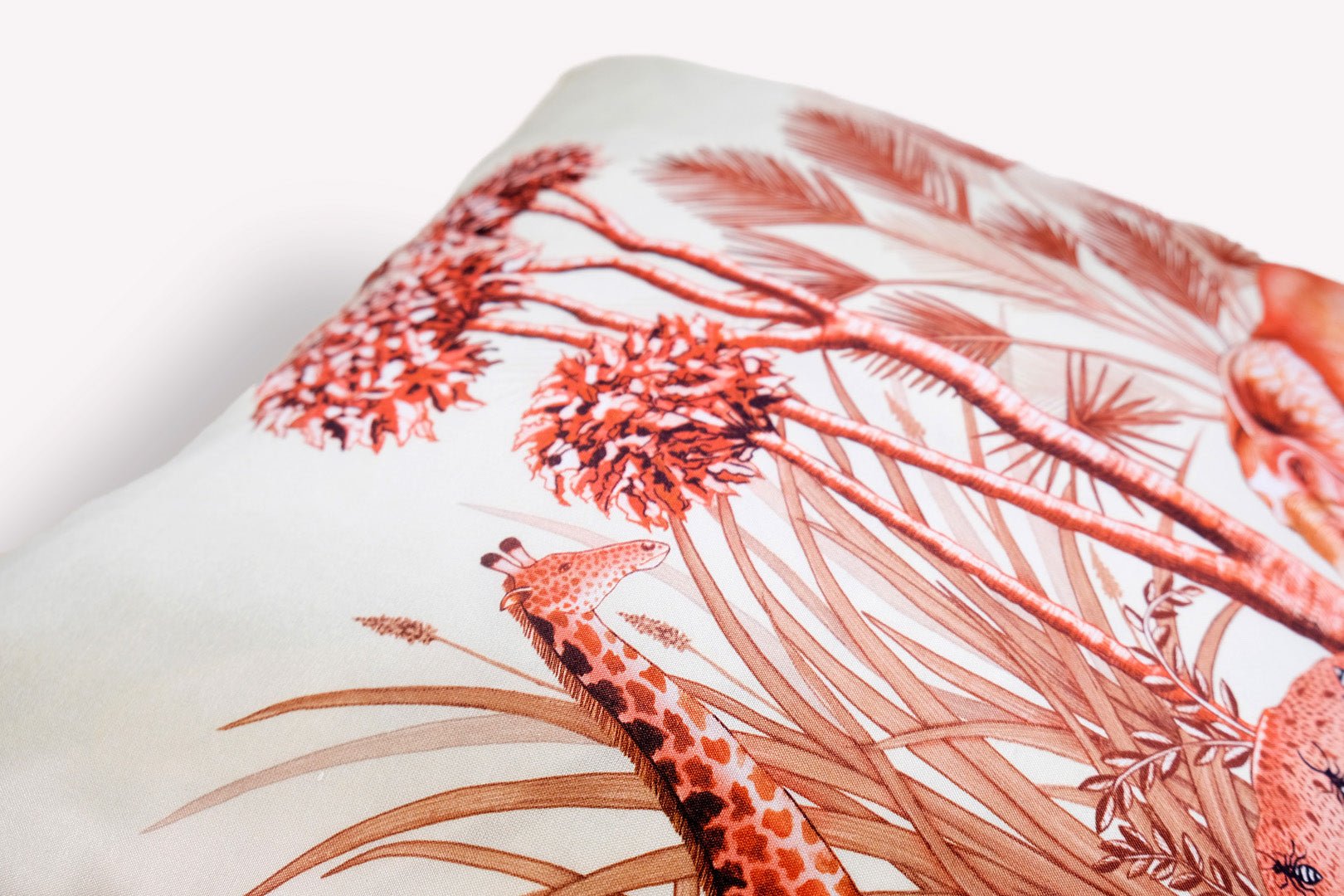 A side perspective emphasising the fine silk texture, the depth of the wildlife print, and the neatly stitched edges.