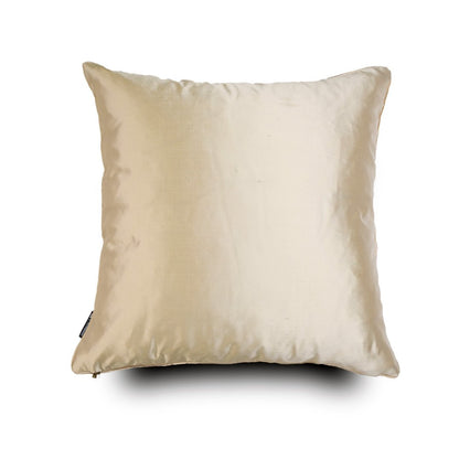 The reverse side of the cushion, showcasing a plain, smooth-textured silk fabric in a neutral tone, finished with refined piping.
