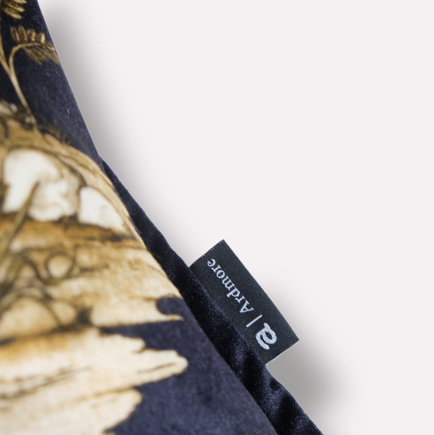 Side view showing the cushion cover’s smooth velvet texture and precise top stitching.