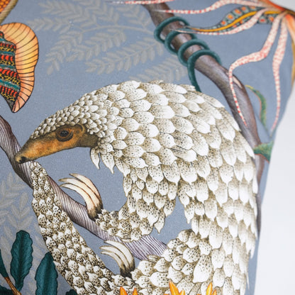 Side angle of the Thanda Pangolin in Ash Velvet Cushion Cover, highlighting the intricate stitching and premium velvet texture.