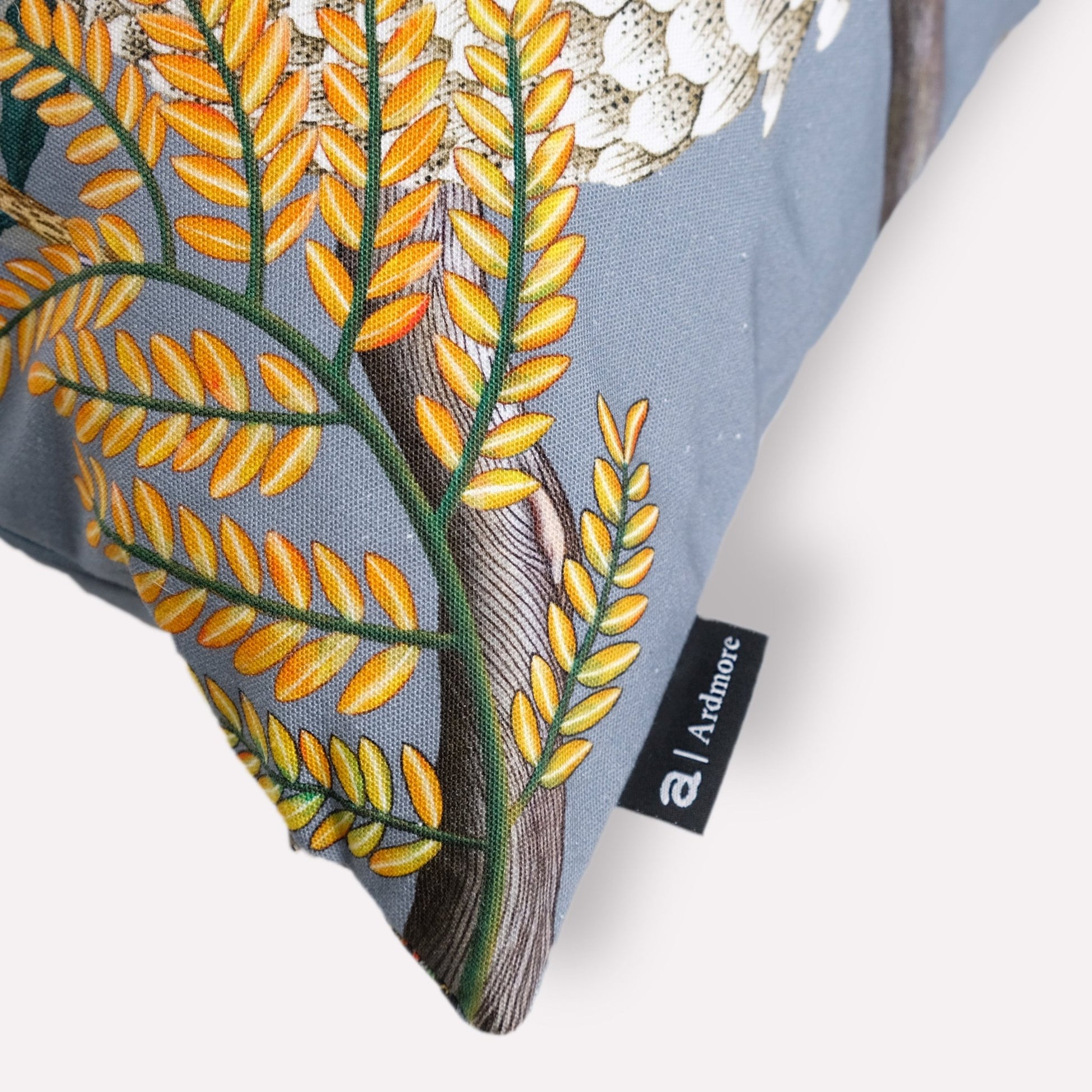 Close-up of the pangolin design on the Thanda Pangolin in Ash Velvet Cushion Cover, emphasising the delicate artistry and vibrant foliage details.